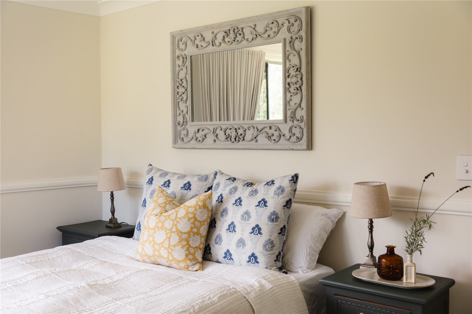 Main bedroom with blue and yellow cushions